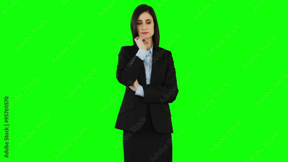 Unsmiling businesswoman pointing at screen Unsmiling businesswoman pointing at screen