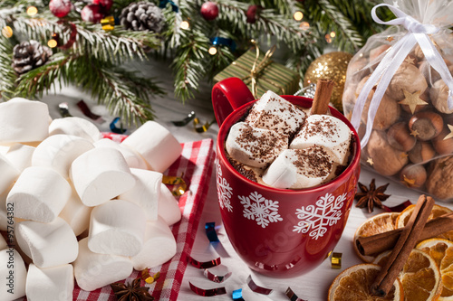 Cup of cocoa with white marshmallow on Christmas table