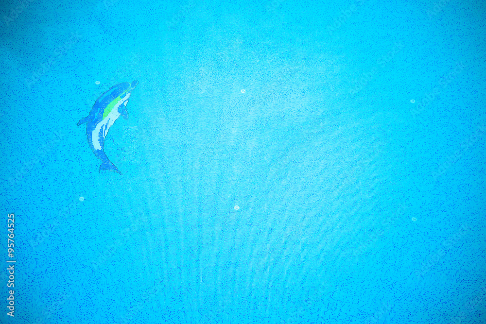 Blue water in a hotels swimming pool. Toned