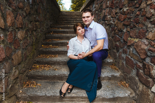 couple sitting on ancient stairs