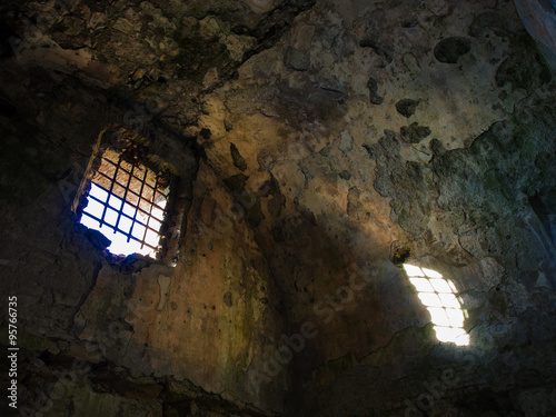 Old ruined prison jail sunlight enters from a window
