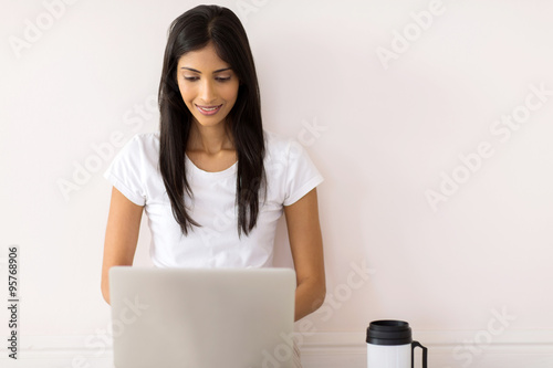 indian girl using laptop computer