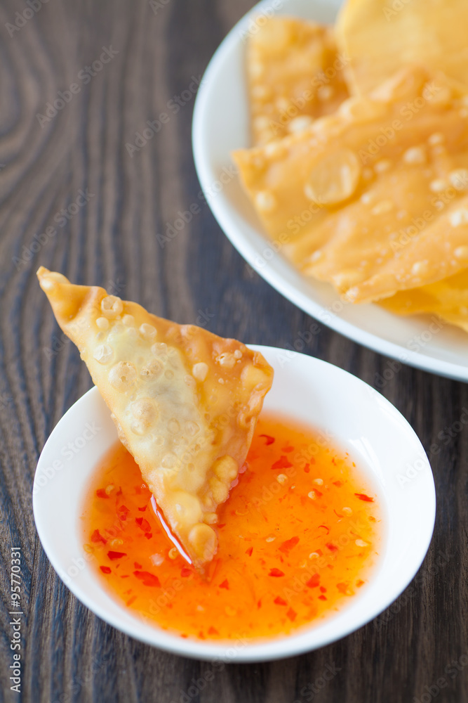 Delicious appetiser chinese cuisine deep fried wonton eat with sweet chilli sauce Delicious appetiser chinese cuisine deep fried wonton eat with sweet chilli sauce