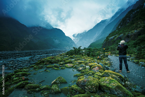 photographer take a photograph in franz josef glacier new zealand destination