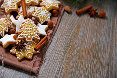 Christmas cookies with spices on wooden table