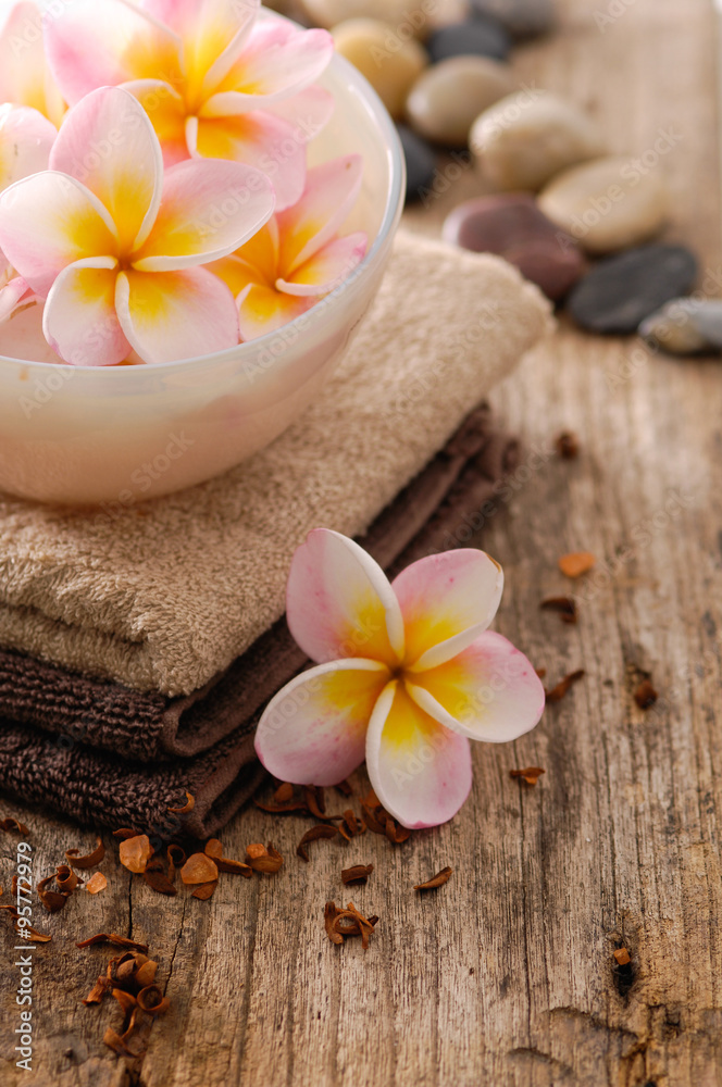 frangipani in bowl and stones ,dry flower petals ,towel on old wood
frangipani in bowl and stones ,dry flower petals ,towel on old wood