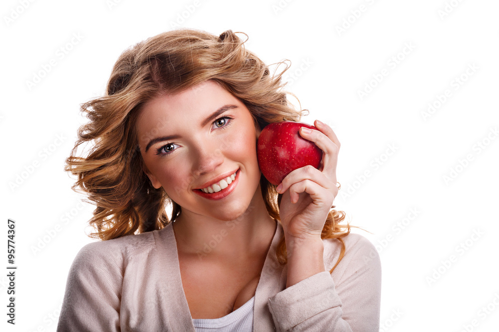 Girl with curly hair holding a red apple and smiling. Girl with curly hair holding a red apple and smiling.