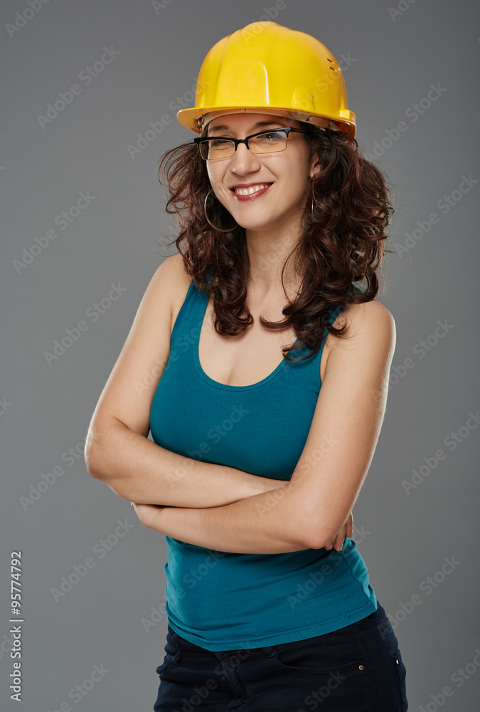Woman wearing a protection helmet, studio portrait Woman wearing a protection helmet, studio portrait