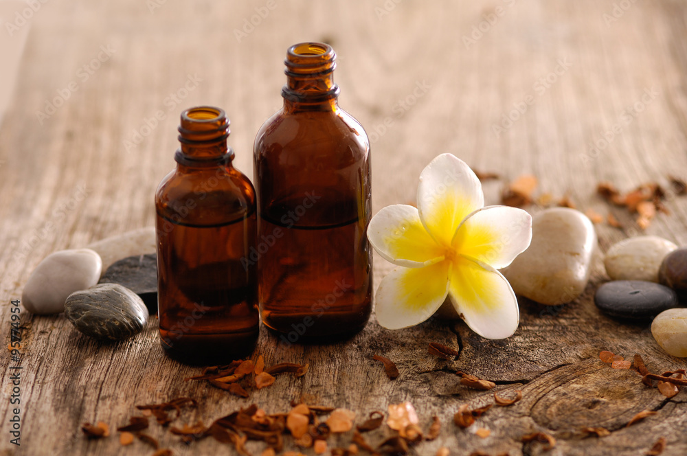 frangipani and massage oil,stones on old wood
frangipani and massage oil,stones on old wood