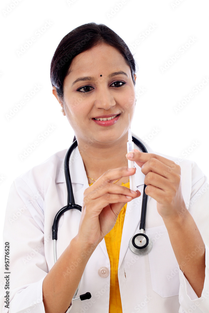 Female doctor holding syringe in hand on white background Female doctor holding syringe in hand on white background