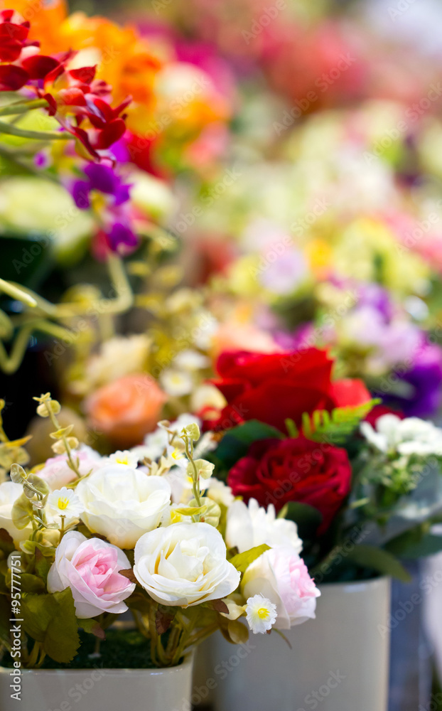 Obraz premium Close up of colorful artificial flowers.