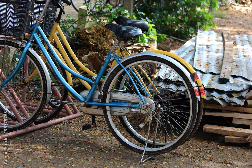 Two Bicycles Parked On The Ground