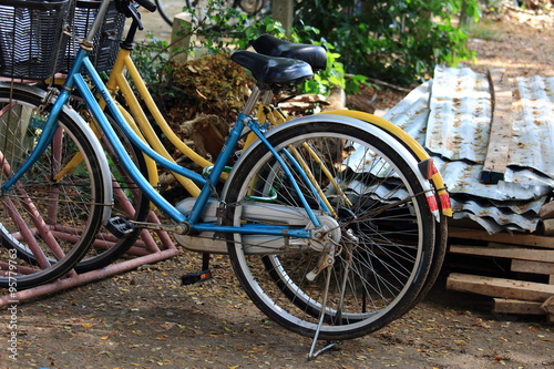 Two Bicycles Parked On The Ground