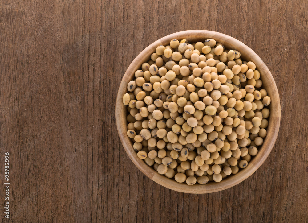 Soy beans in a wooden bowl Soy beans in a wooden bowl