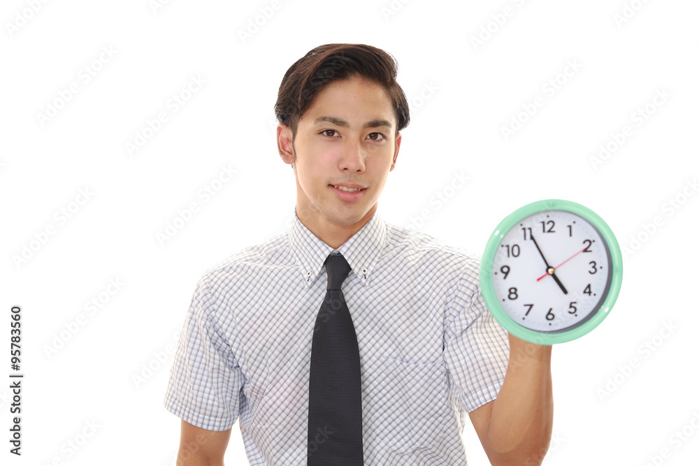 時計を持つ笑顔のビジネスマン