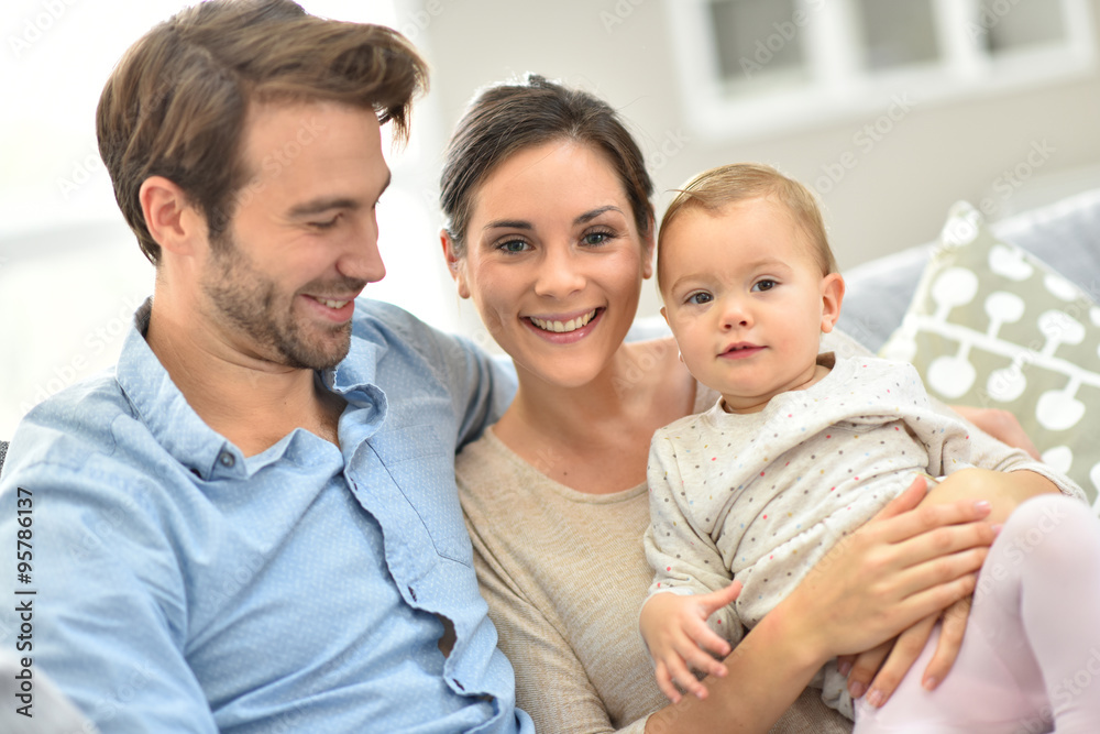 Obraz premium Portrait of happy young family of three