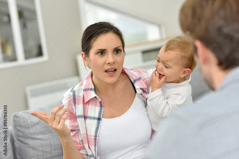 Man and woman arguing in front of baby Man and woman arguing in front of baby