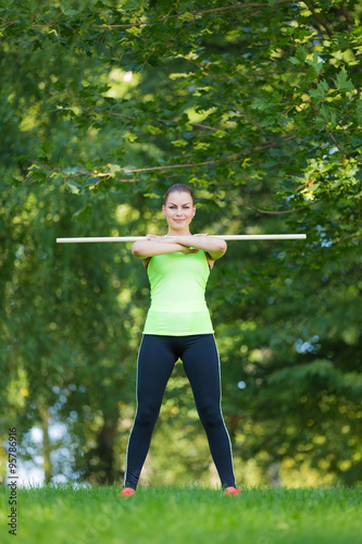 Fit woman exercising in park