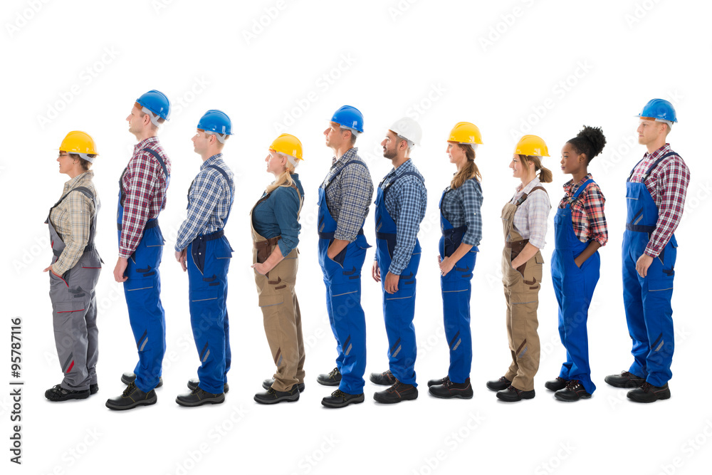 Obraz premium Side View Of Carpenters Standing In Line