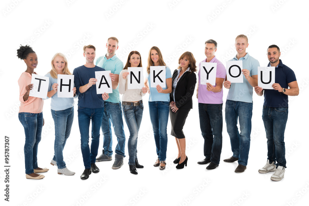 Creative Business People Holding Thank You Sign