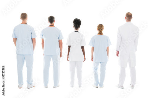 Medical Team Standing Against White Background