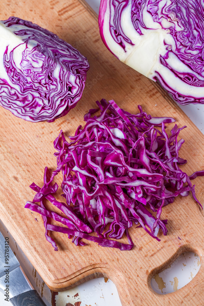 Sliced red cabbage on wood board Sliced red cabbage on wood board