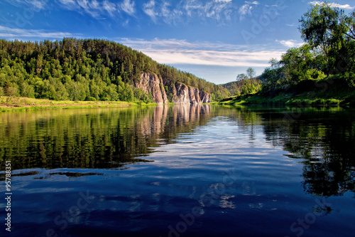 Fototapeta Naklejka Na Ścianę i Meble -  Lake with hills and red cliff