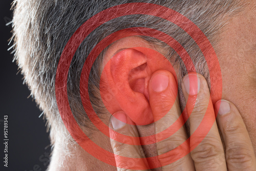 Man Covering Ear With Hand photo