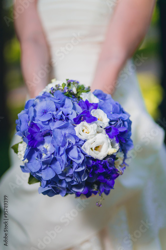 Bride holding lilac wedding bouquet