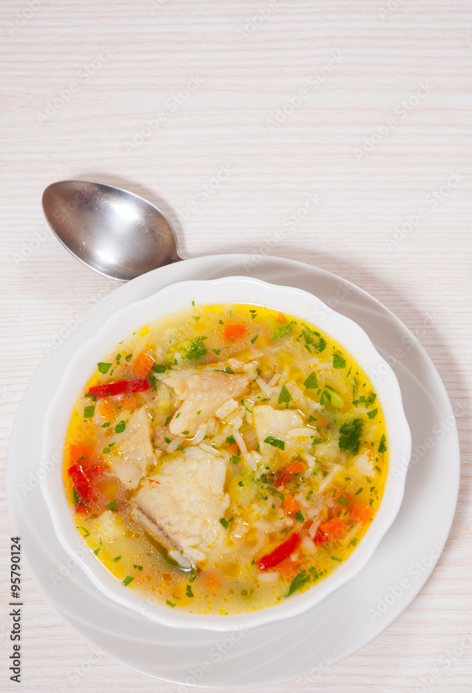 Fish soup with vegetables and rice