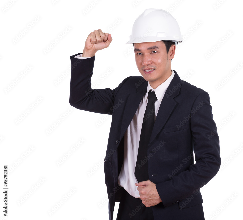 Happy young engineer celebrating with arm raised, concept of suc Happy young engineer celebrating with arm raised, concept of suc