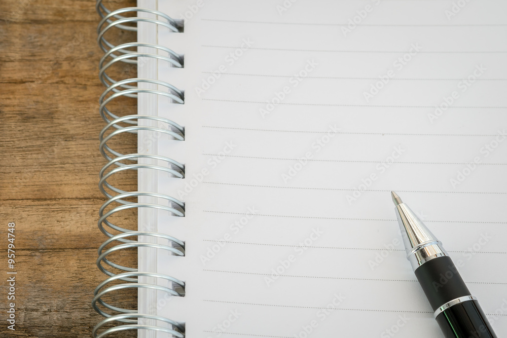 blank notebook and pen on wooden table blank notebook and pen on wooden table