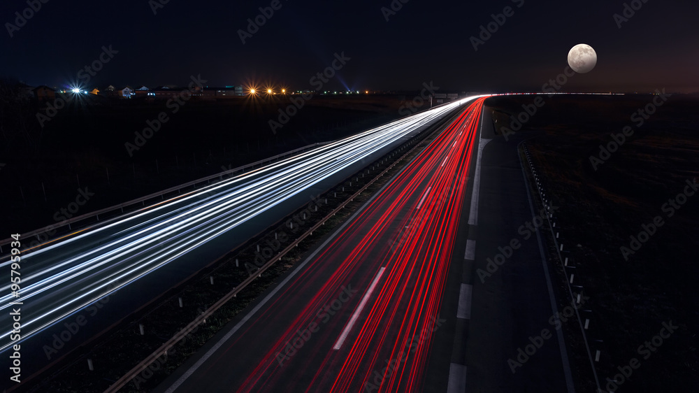 Fast driving on highway at night of full moon Fast driving on highway at night of full moon