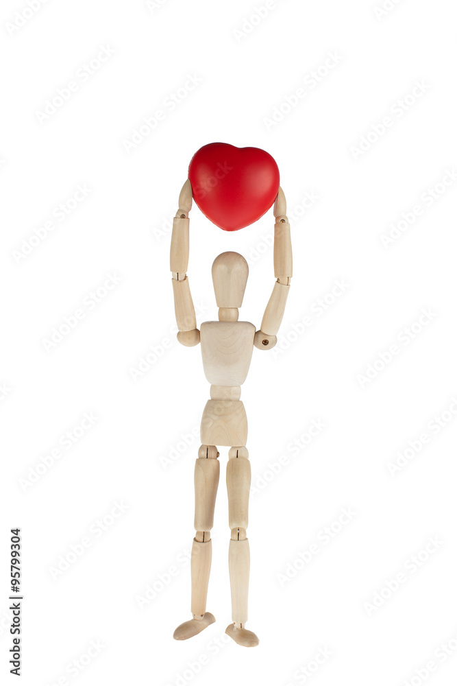 wooden model doctor holding a heart symbol wooden model doctor holding a heart symbol