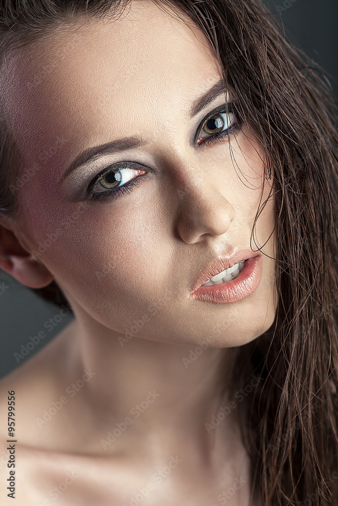 Fototapeta premium beautiful young woman with long hair and bright make-up