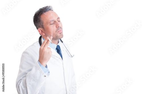 Doctor or medic enjoying a cigarette break © Catalin Pop