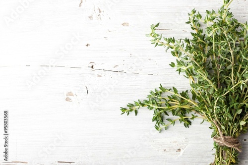 Bundle of thyme on the white board horizontal