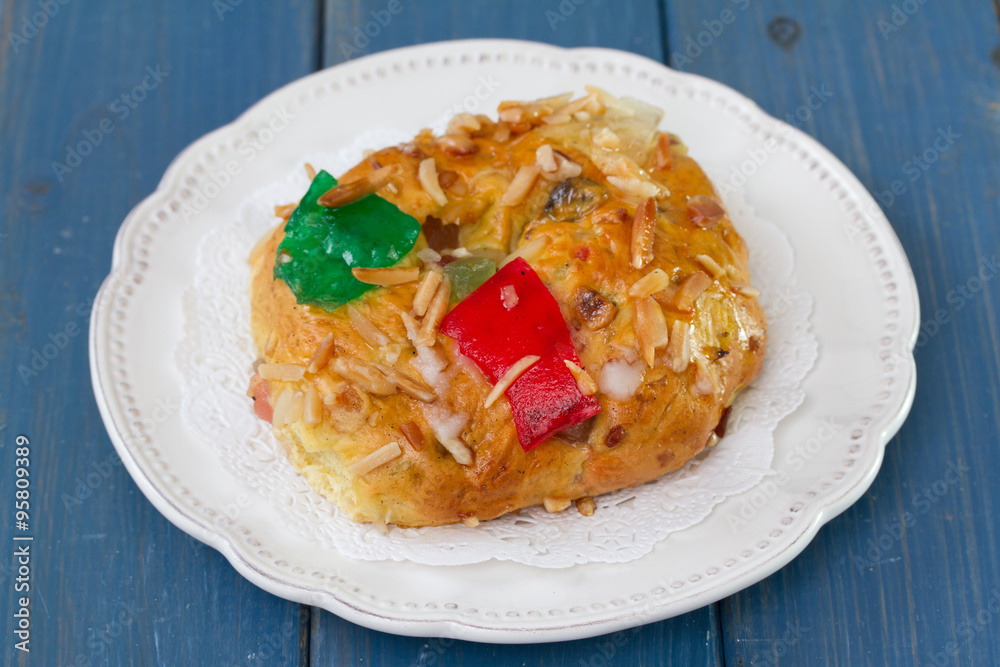 cake with dry fruits and nuts on blue wooden background