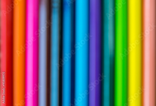 Blurred line of colored pencils.