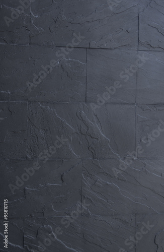 black granite stone wall background and texture