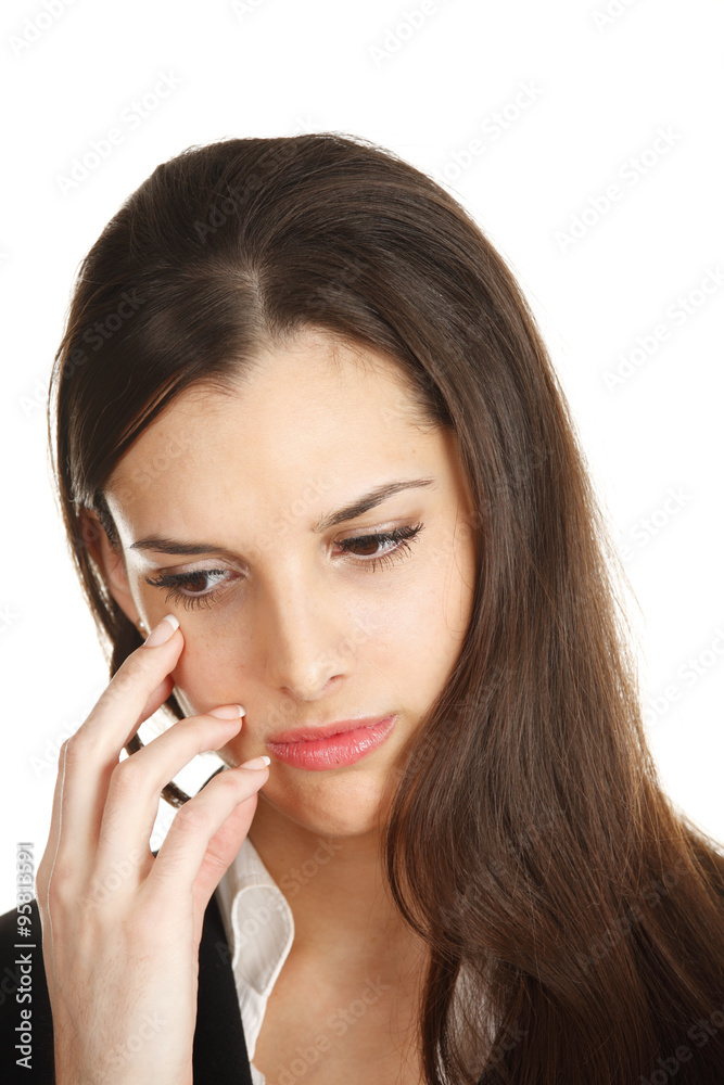 A woman with a look of concern or worry on her face. A woman with a look of concern or worry on her face.