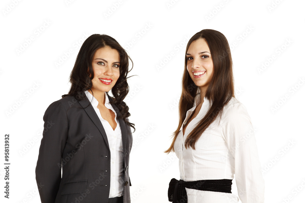Two woman smiling at viewer.