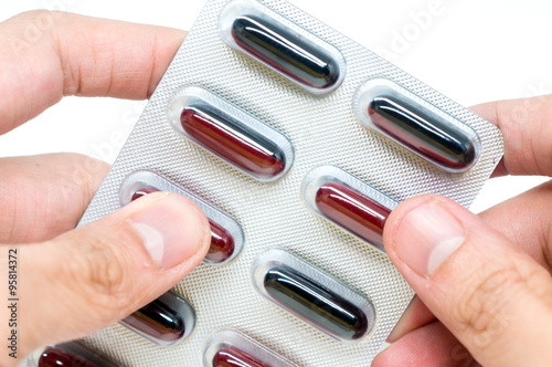 brown black color soft gel capsules in aluminum blister pack foi