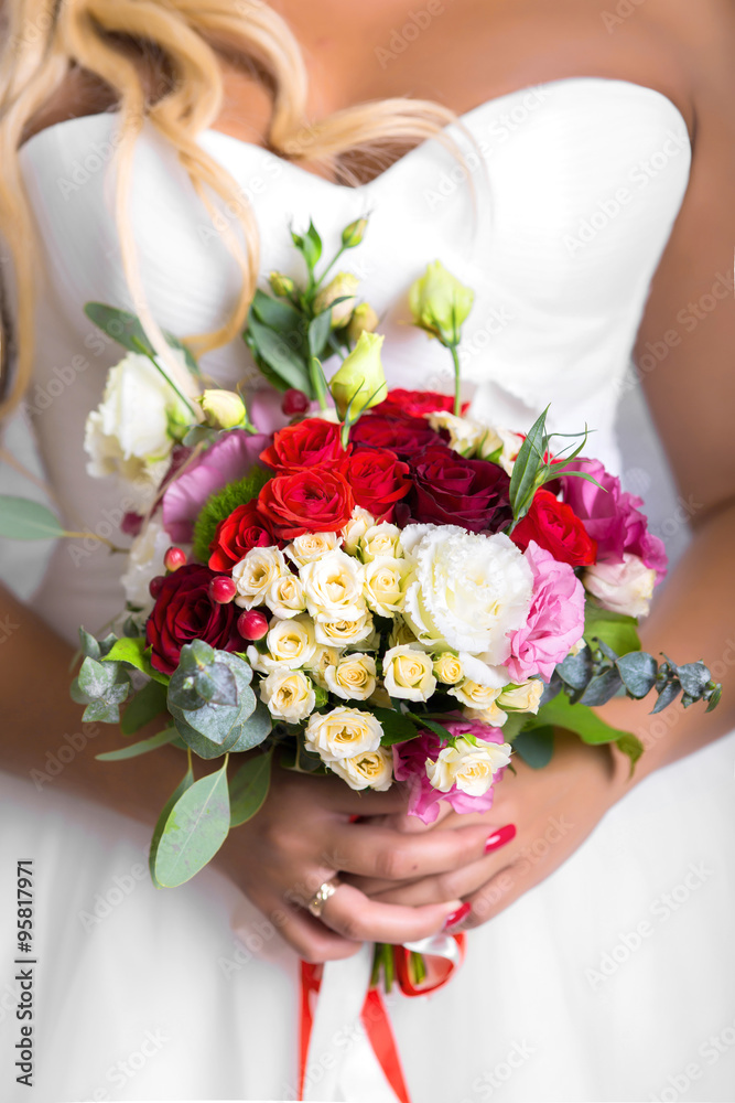 bride holds bouquet