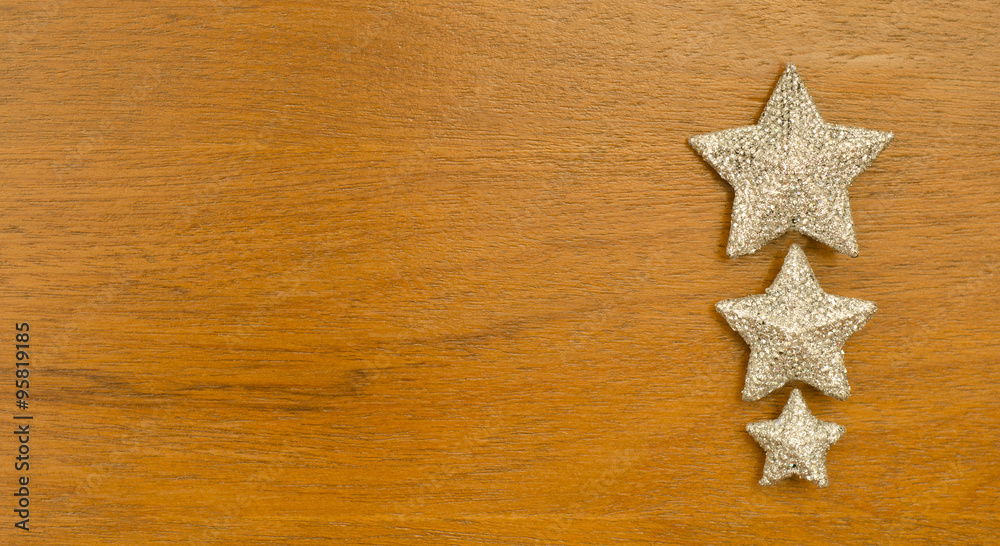 Silver Christmas star on wood background . Silver Christmas star on wood background .