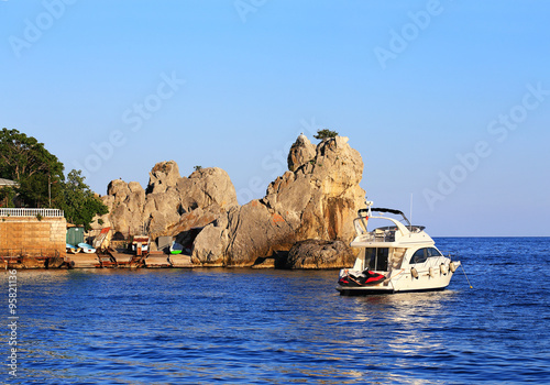 Boat at the rocky coast photo