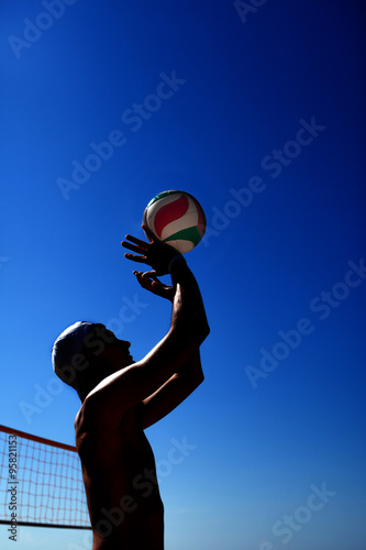 man is playing volleyball © producer
