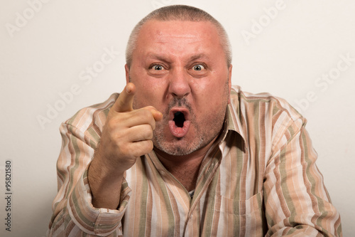 Angry man pointing finger