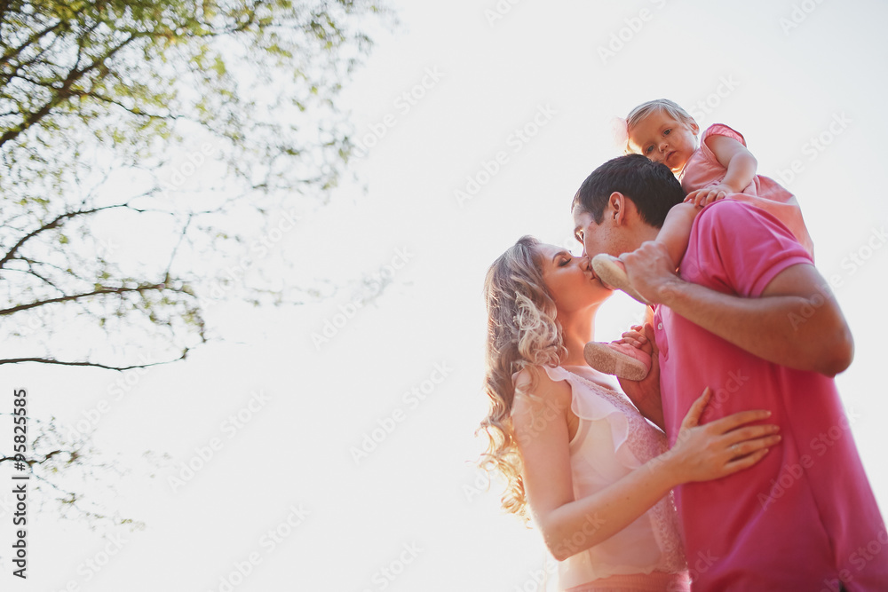 beautiful family of three people, mom dad and daughter beautiful family of three people, mom dad and daughter