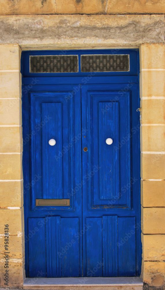 Details of a blue front door in Malta.